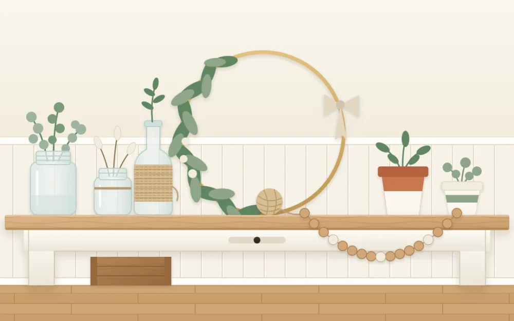 A wooden work table with handmade accents in a row: a greenery hoop wreath, two glass jars with stems, a twine-wrapped bottle, wooden beads and two painted pots