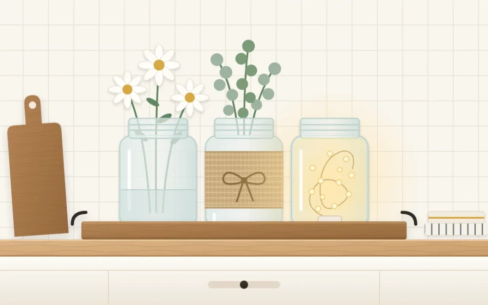 Three clear glass jars on a wooden tray: one with white daisy-like flowers, one wrapped in twine with green stems, one glowing from a small battery light