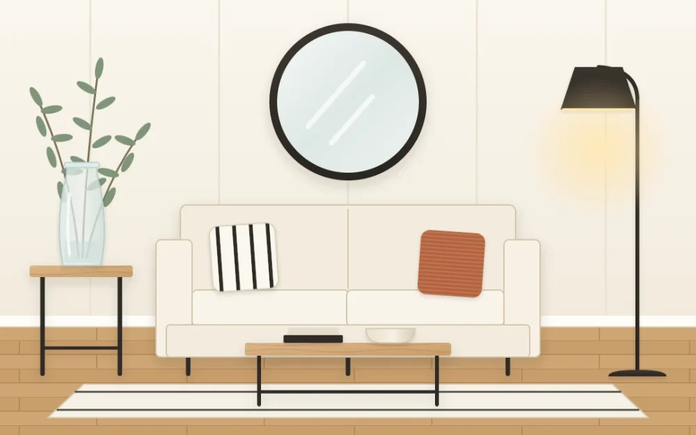 Modern farmhouse sitting area with a clean-lined cream sofa, a slim black metal coffee table with a wooden top, a black floor lamp and a large round black-framed mirror